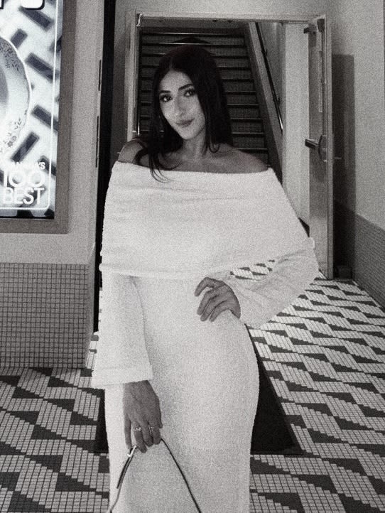 woman in black bikini top on body of water during daytime